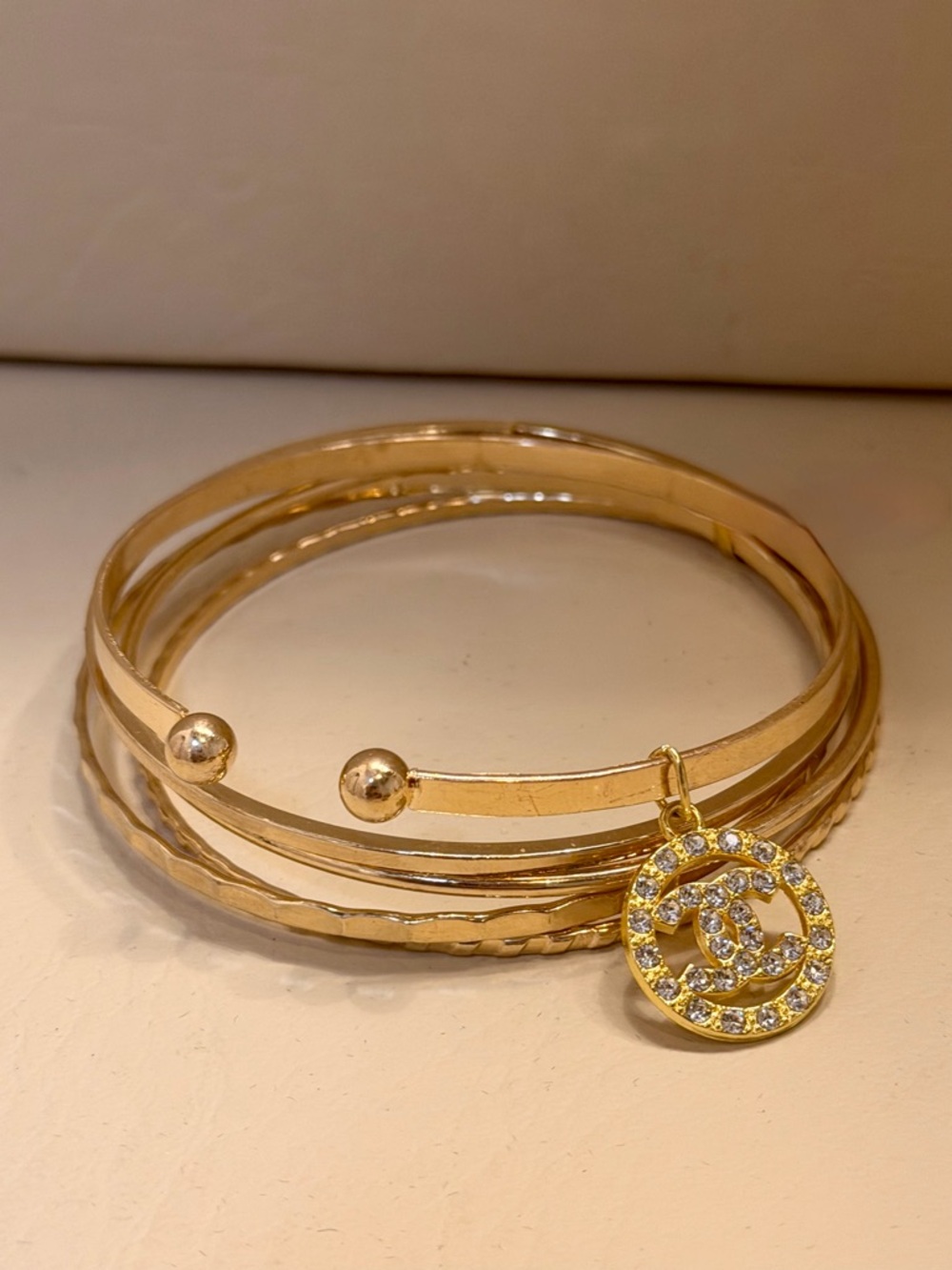 CC Stacked Five Gold-Tone Crystal Logo Charm Bangle Bracelet